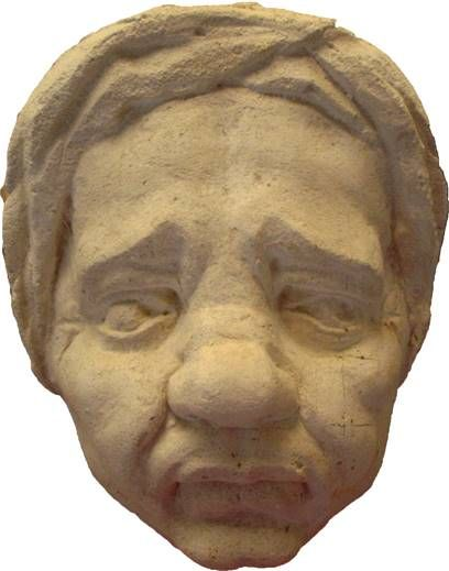 kopie maskarona (románský portál, Francie) provedení ve vápenci